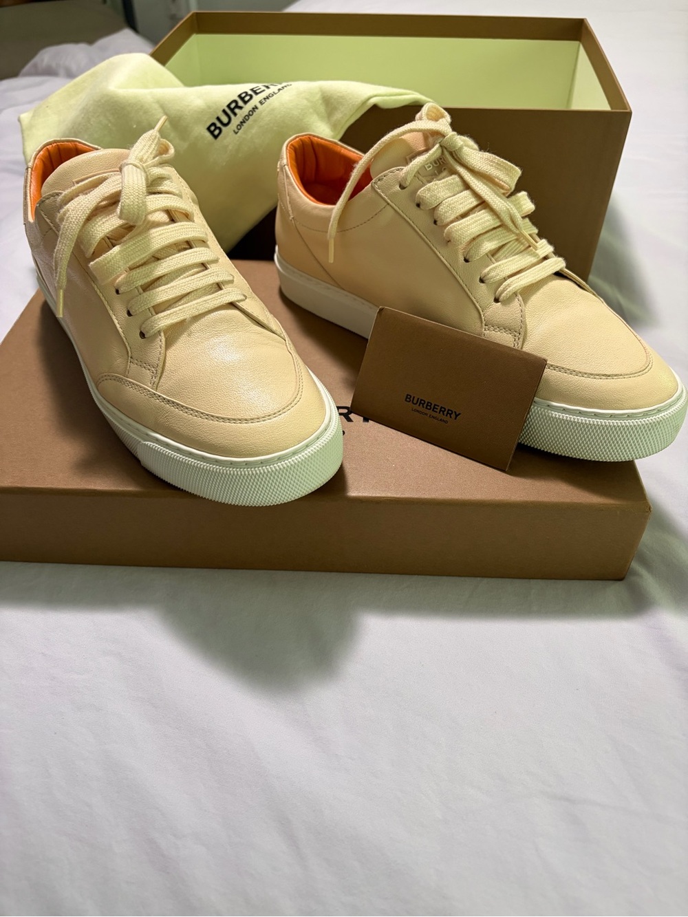 Burberry women’s Cream Leather Sneakers with Orange Lining